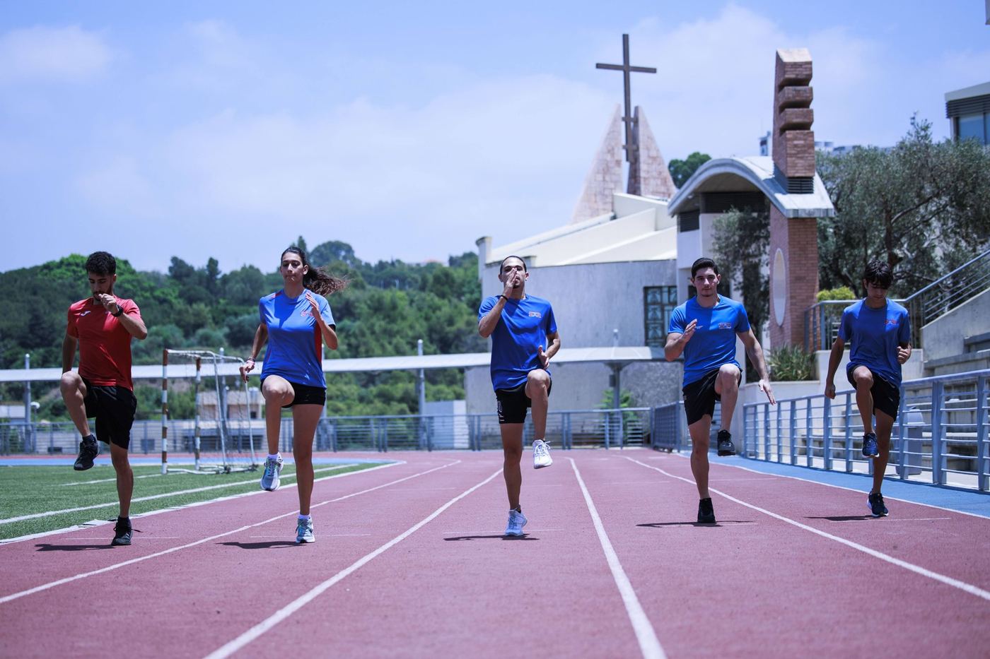 SAS students running on the Baabda athletics track